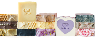 All Blissed Botanical Cold Process Soaps in a line