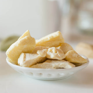 Small dish of kokum butter on the kitchen countertop while making cold process soaps