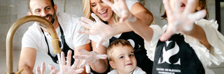 Blissed Botanical Co Founder and her family wearing matching aprons and washing hands 